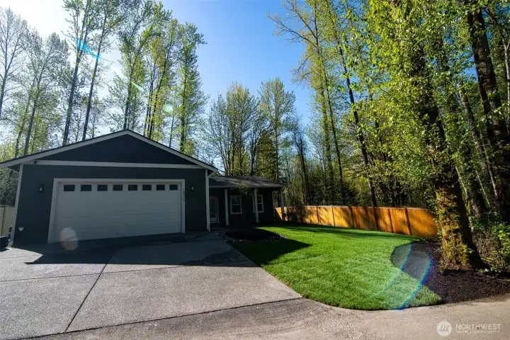 Mature natural landscaping and fenced side and backyard.