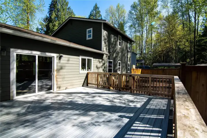 Entertaining easily moves from the kitchen to the back deck, just calling for summer bar-b-ques and relaxing evenings under the stars!