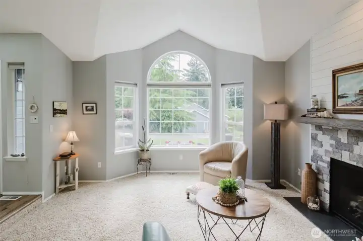 Living room with vaulted ceilings and so much light