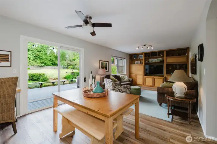 Eat-in area with slider to deck, looking into front room