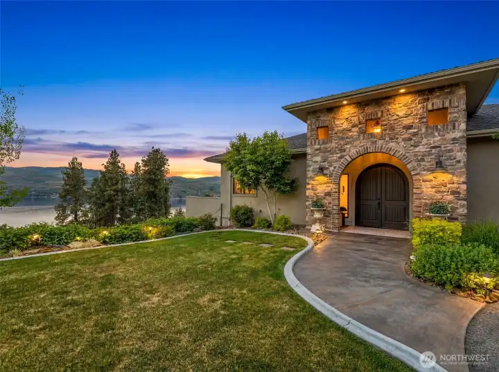 Grand stone entry welcomes you to this Lake Chelan view home at 356 Karma Kanyon Drive!