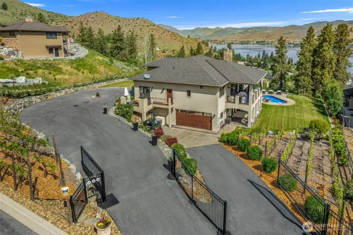 Stunning hillside retreat featuring a private vineyard and lots of parking via two gated entrances