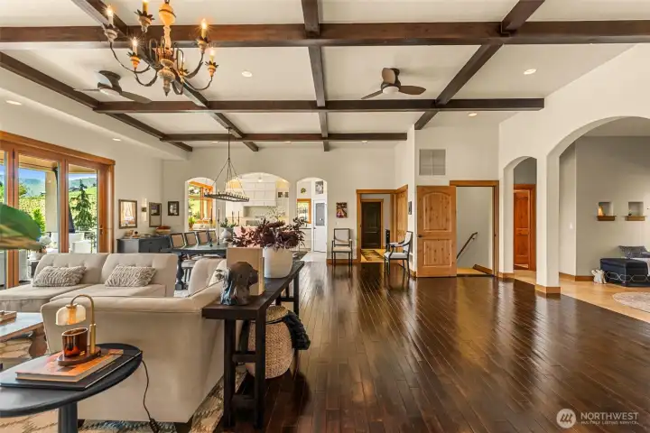 Thoughtfully designed living spaces offer warmth and elegance. Soft architectural arches beautifully balance the home’s grand scale