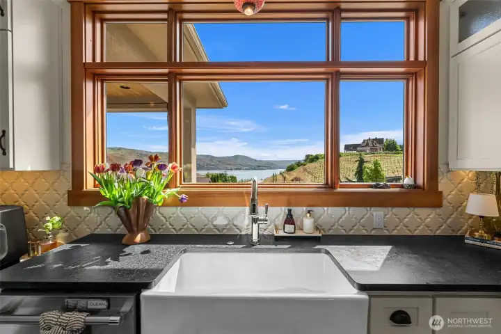 Even doing dishes in the farmhouse sink comes with stunning Lake Chelan, mountain and vineyard vistas. And enjoy your brand new polished chrome faucet!