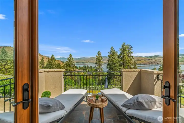 What better way to start your mornings than with coffee and panoramic lake and mountain views from the private primary suite balcony?
