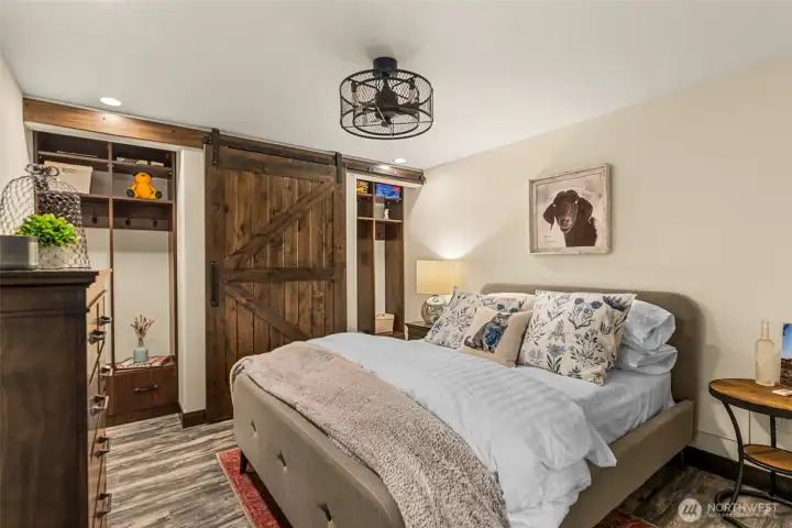 Stylish barn door from family room adds warmth, character, and flexible access to the adjoining bonus space