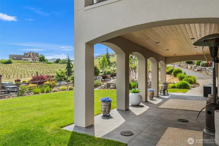 Resort-style covered patio offers shaded comfort, architectural charm, and peaceful vineyard surroundings