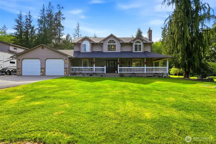 Attached two car garage & wrap around porch Attached two car garage & wrap around porch