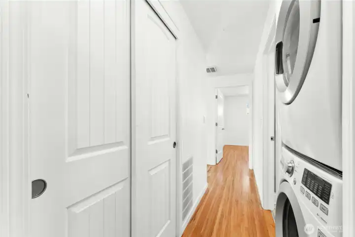 Hallway with stackable W/D that stay with home. Hallway with stackable W/D that stay with home.