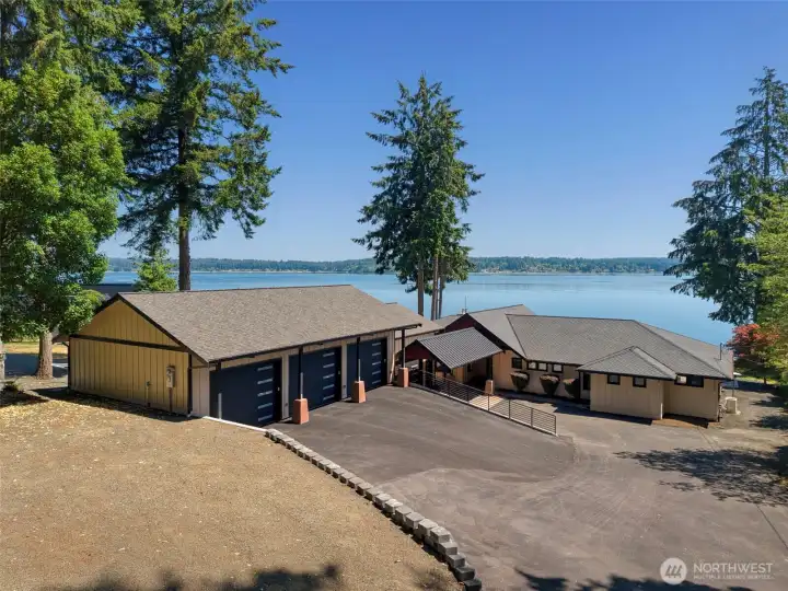 Watefront luxury plus a huge climate control garage with additonal workout room/shop