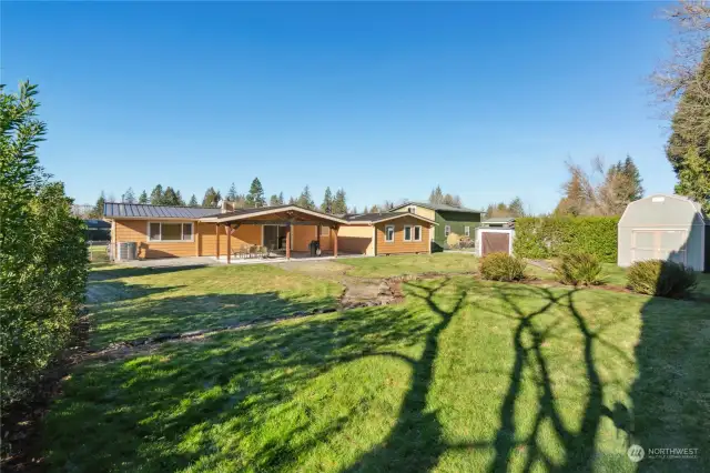 Manicured lawn and mature plantings.