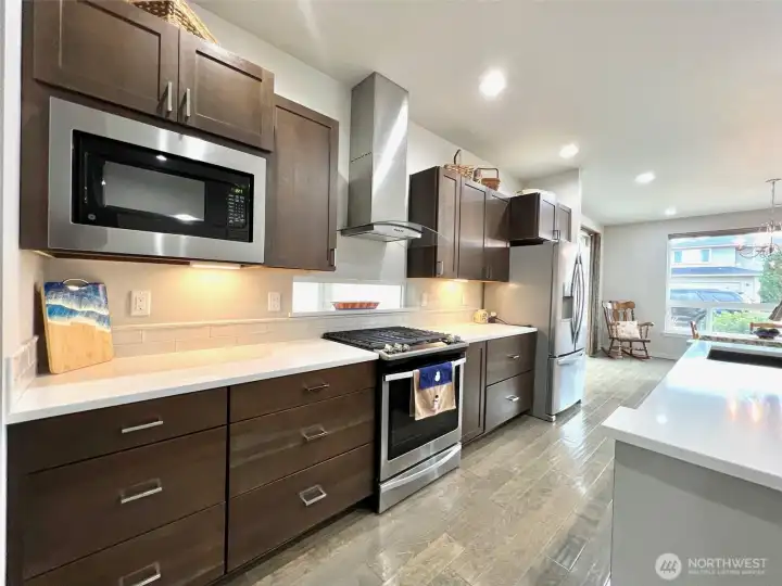 The kitchen blends sleek design with natural warmth.