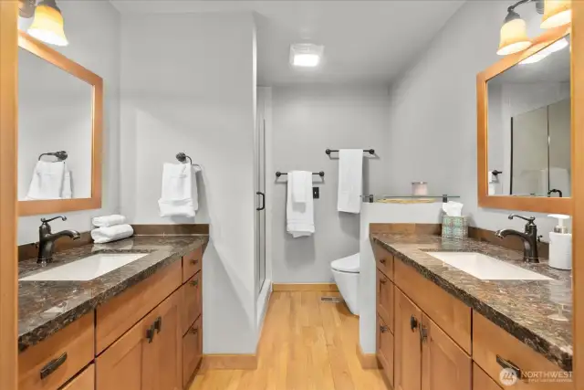 Primary Updated Bathroom with 2 Sinks and a Shower.