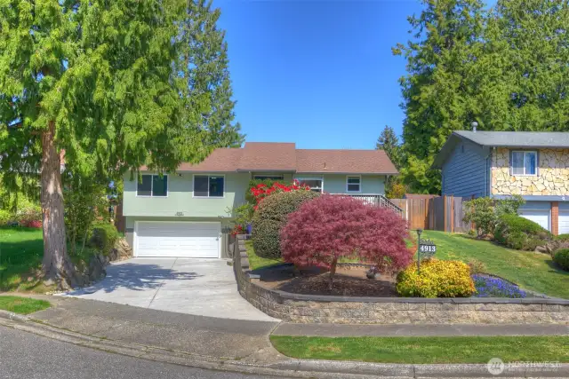 Lovely mature landscape and spacious driveway.