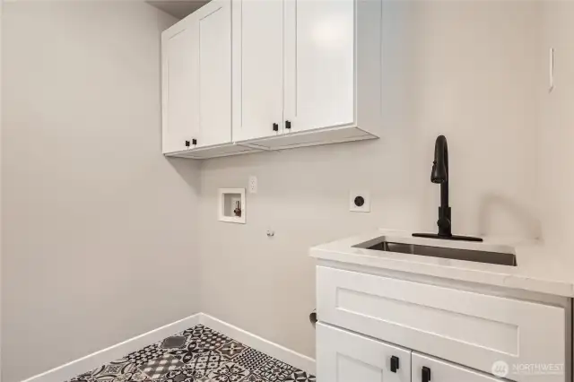 Laundry on Main with laundry sink and fabulous pantry.