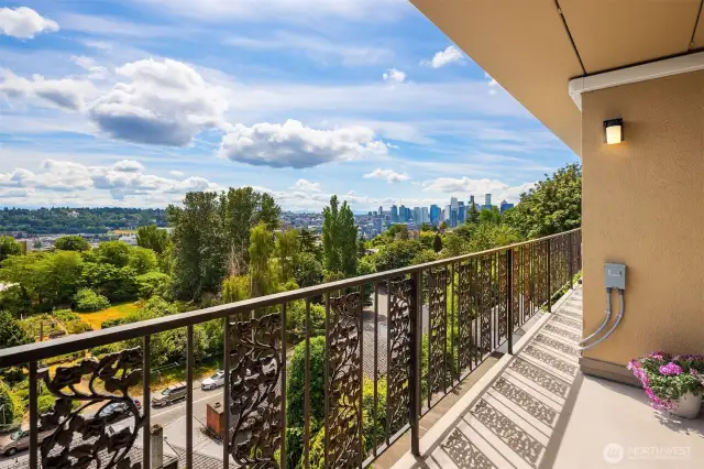 Large deck expanding the length of the entire unit. Looks towards downtown and Mt. Rainier
