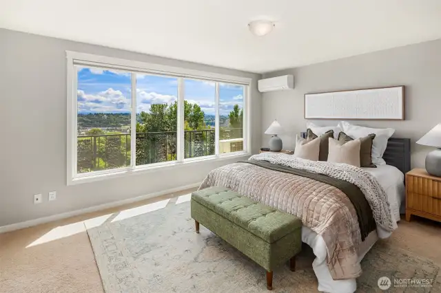 Primary bedroom with A/C and gorgeous views showcasing the best sunrises!