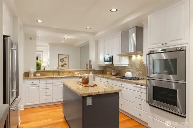 Well appointed chef's kitchen with high grade, stainless steel appliance package and convenient prep island in second cabinetry color. So on trend!