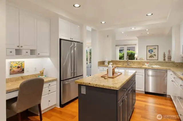 Another view of the kitchen shows off the generous amount of cabinetry and the thoughtful, built in desk.