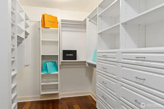 Custom closet system makes beautiful work of managing the entire wardrobe.