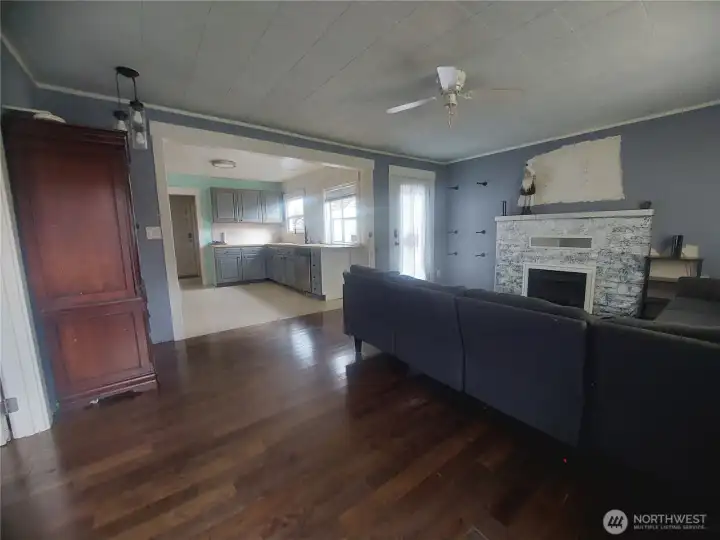 Livingroom w/ Wood Burning Fireplace & Hardwood Floors