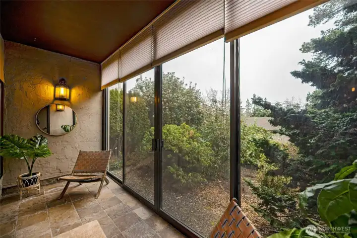 The sunroom's blinds provide privacy when extended floor to ceiling.