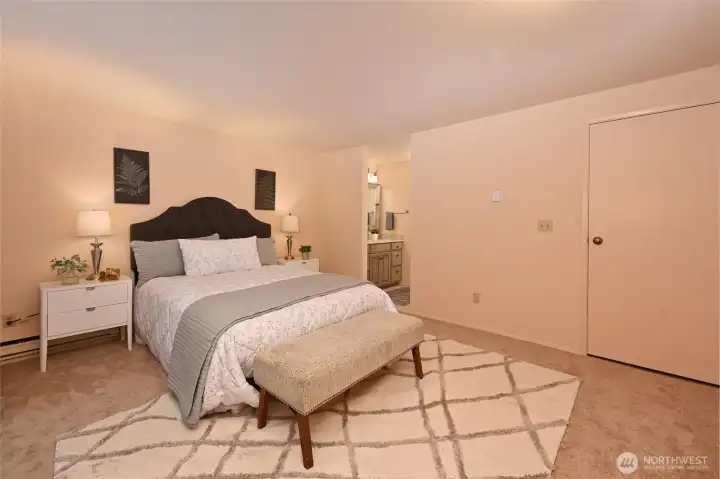 The master bedroom opens onto its bath and a dressing area with a large closet.
