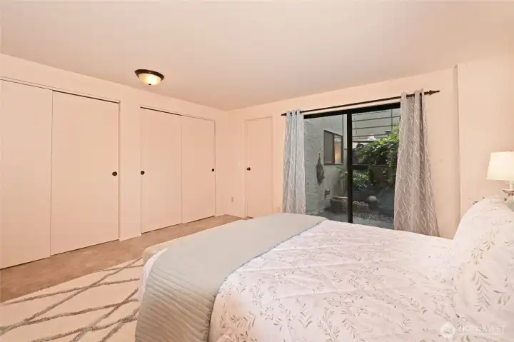 There are three closets in the master suite. On the right is a walk-in closet. There are also two six foot wide closets in this picture.