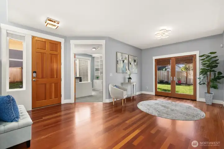 Private office off of entry. French doors to the fenced back yard and patio.