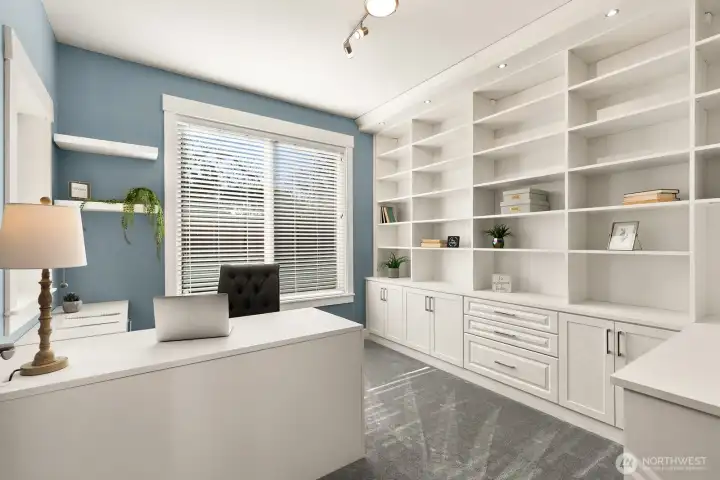 Private office off entry with custom California Closet bookshelves and cabinets.