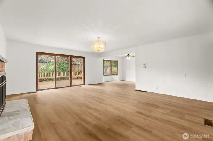 Large sliding doors lead to even larger deck with build-in seating