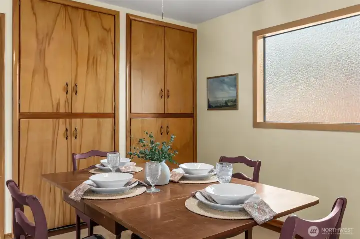 Built in cabinets in formal dining space can also be a bedroom.