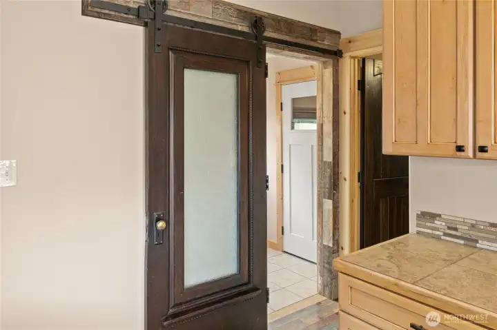 Original Front Door repurposed as barn door slider.