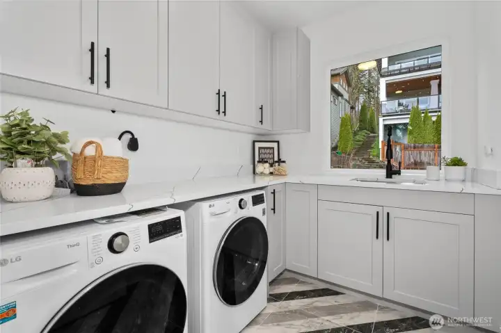 Laundry room upstairs with sink