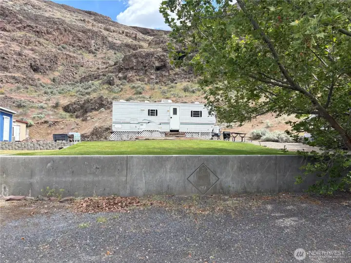 View of lot including the travel trailer. Ready go your first night.