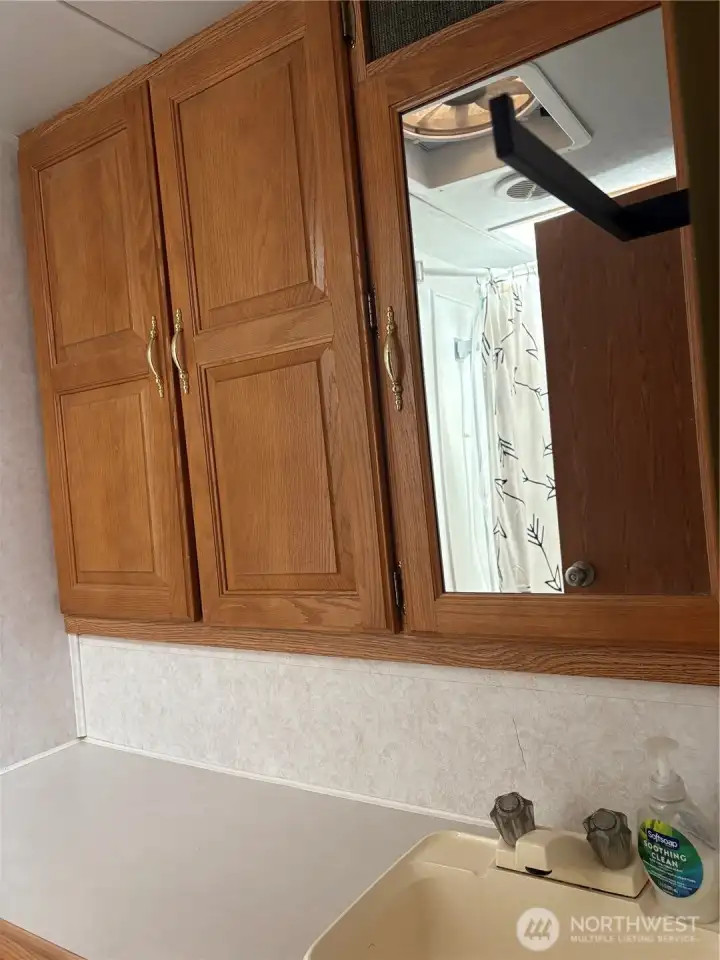 Bathroom includes a sink , toilet and shower.