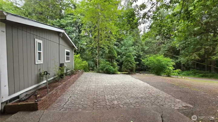 Pretty cobblestone and brick planter - 2nd patio or more parking.