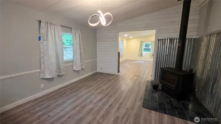 Dining room/family room has a wood stove and is open to a large second family room - terrific for multi-generational families who want privacy.