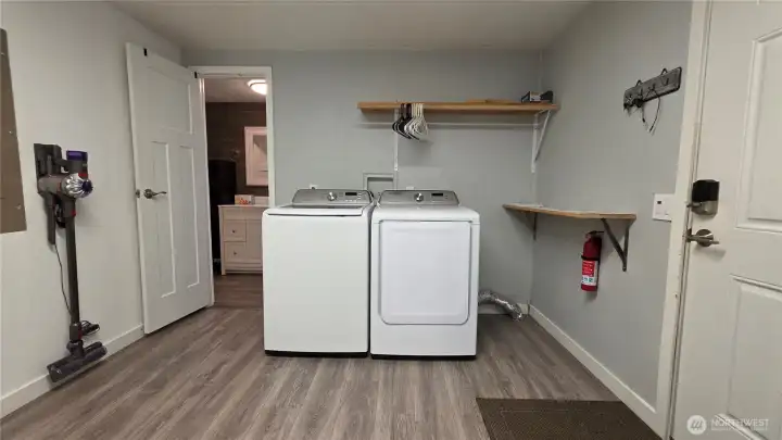 Extra large laundry room with entry to the primary bedroom + exterior entry