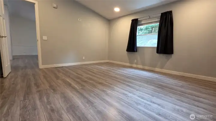 Beautiful laminate flooring throughout is nearly new
