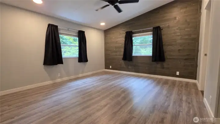 Primary bedroom has a nice accent wall and 2 large windows provide plenty of natural lighting