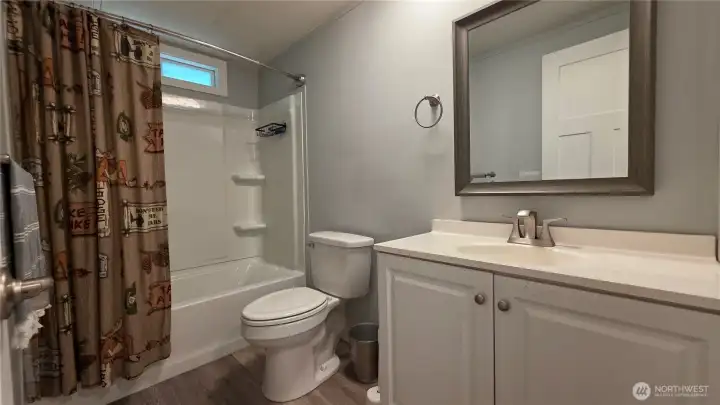 Main bathroom off family room + 2 secondary bedrooms