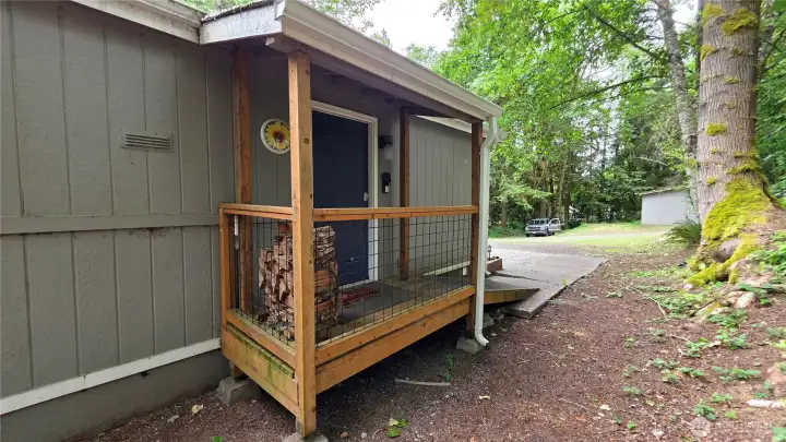 Covered back porch leads to the laundry/mud room and is ramped for convenience