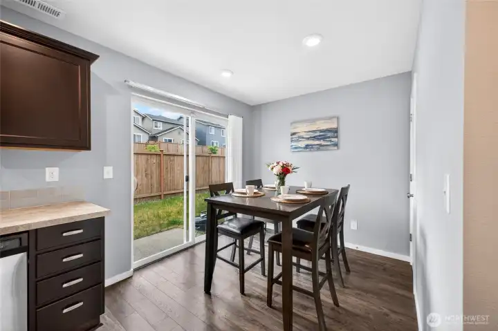 Access to the backyard through the sliding glass door ideal for indoor-outdoor living & BBQ grilling.