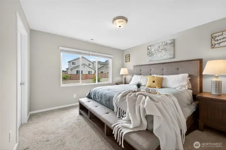 Primary suite includes a walk-in closet with a large connecting bathroom.