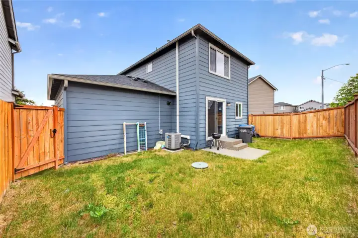 Fully fenced backyard ideal for pets and private enjoyment.