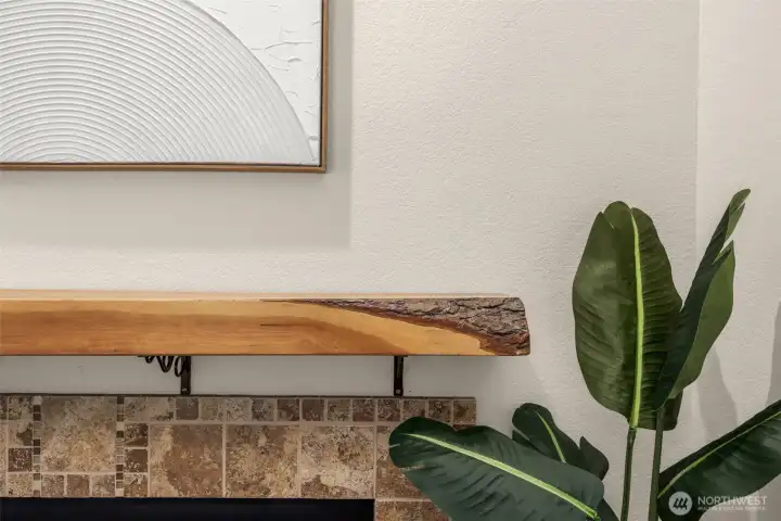 There is a custom made cherry wood mantle which came off of a previous owner's farm back East.