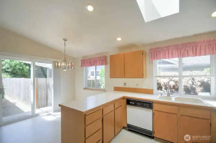 Dining area showing glass slider to covered back patio