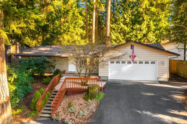 Beautifully remodeled home tucked away in the trees.  New roof and gutters were completed in the Spring of 2024