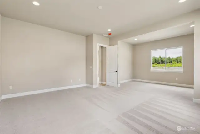 Another angle showing the sitting area looking out to the rear yard, from the primary bedroom